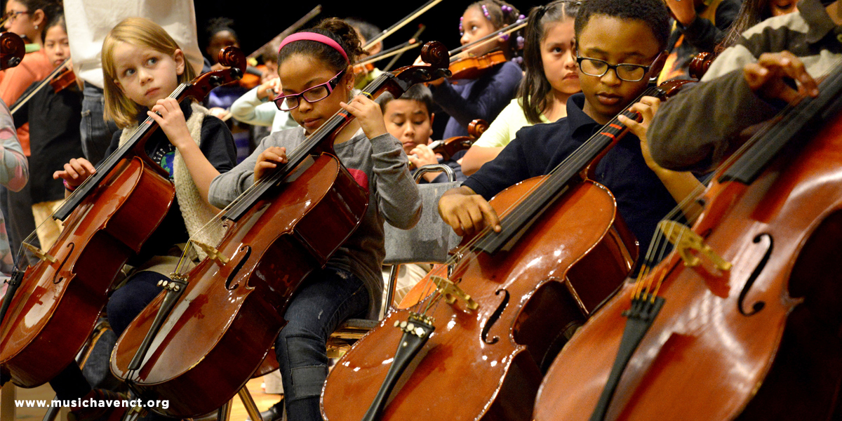 Children playing cellos.