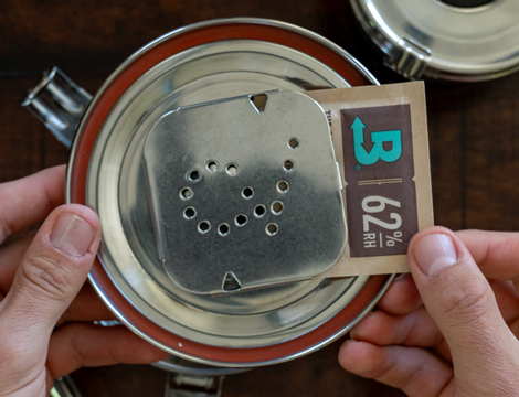 Boveda being placed into a CVault lid.