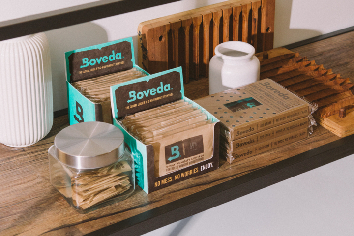 Selection of various Boveda packs on a shelf.