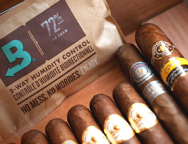 Boveda packet, wood humidor and cigars