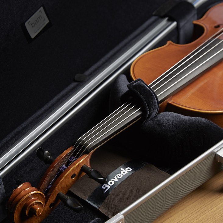 Boveda placed underneath small bowed string instrument