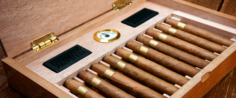 Picture of humidor with cigars and built in hygrometer