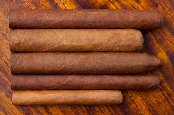 Variety of cigars grouped together on table top