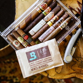 Boveda sitting on top of an acrylic humidor full of cigars.