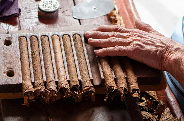 A hand rolling premium cigars