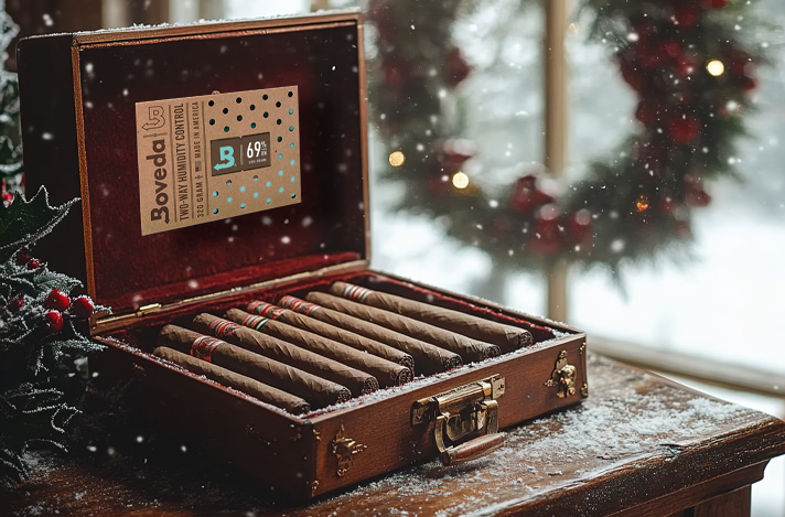 Boveda 69% RH brick in a wood humidor with holiday decorations around