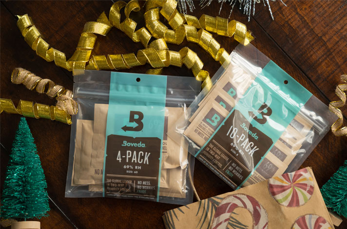 Boveda 4 and 10 packs of 69% RH with holiday decor surrounding it