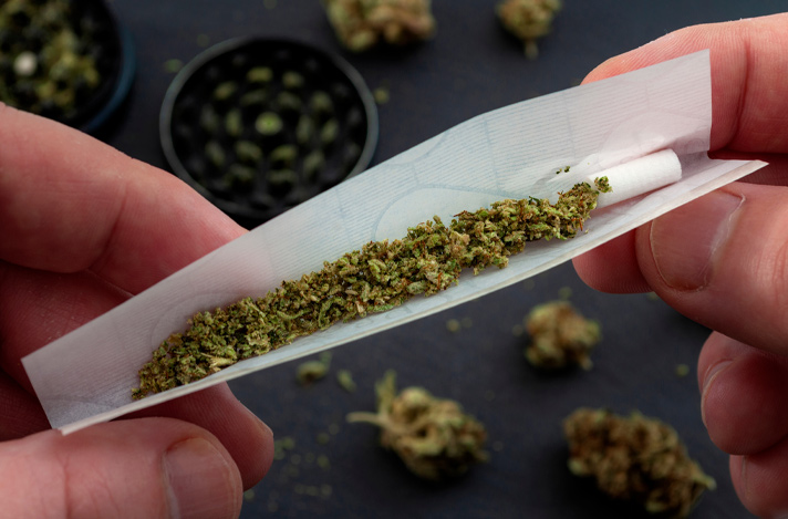 A person rolling a joint