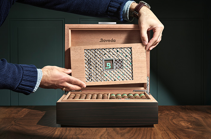 Boveda Humidor with 320 being placed