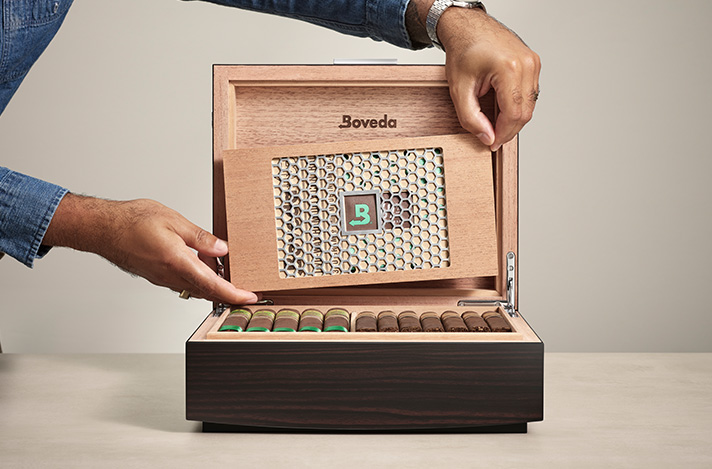 Boveda Humidor 50 count with a size 320 being placed inside.
